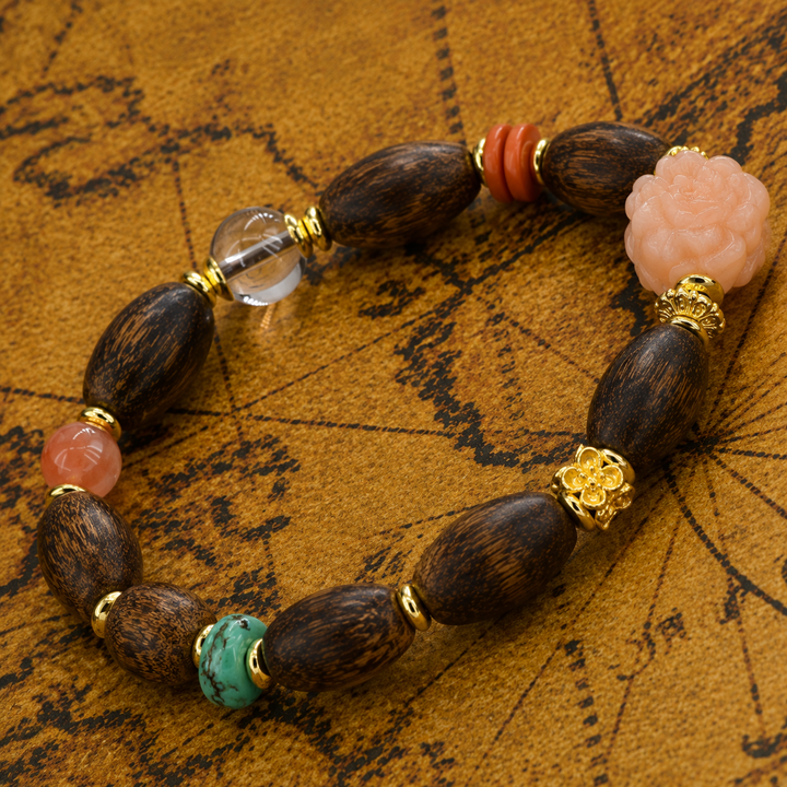 Himalayan Artisan Crafted Dark Wood Oval Bead Bracelet Featuring Carved Pink Peony Quartz, Turquoise, Clear Crystal, and Gold Accents