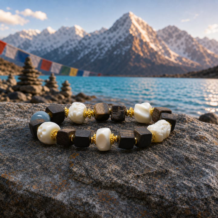 Himalayan Handcrafted Square Dark Wood Bead Bracelet Featuring Carved Bone Skulls, Barrel Motif, Blue Agate, and Gold Accents