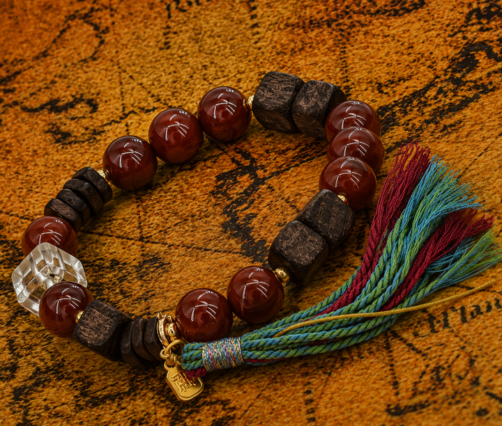 Handcrafted Red Agate & Dark Wood Beaded Bracelet Featuring Clear Quartz Cube, Gold Spacers, Lucky Charm Pendant, and Multicolored Tassel