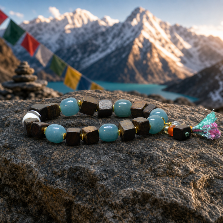 Authentic Himalayan Dark Wood & Blue Aquamarine Beaded Bracelet Featuring Sacred Dzi Bead Centerpiece, Gold Spacers, and Artisan Tassel